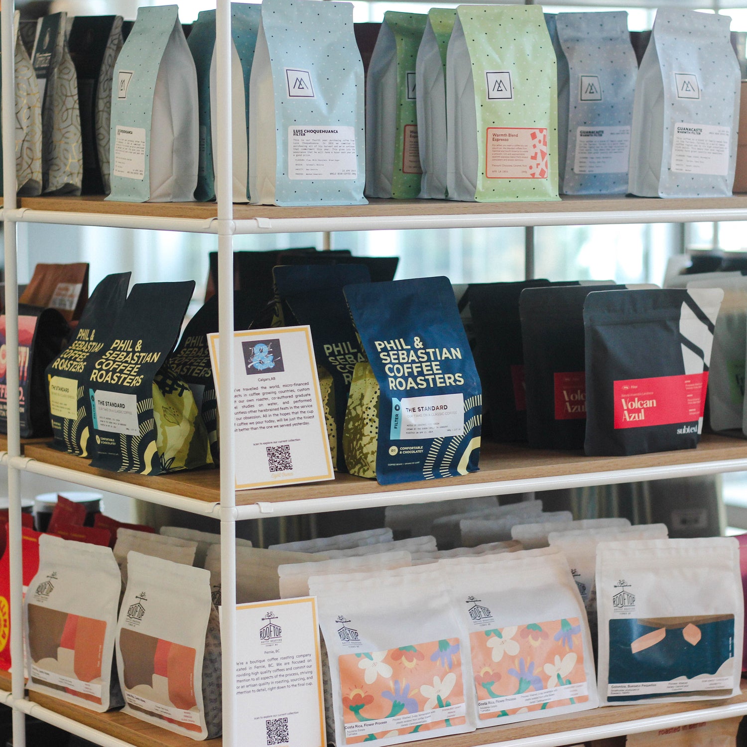 Bags of coffee displayed on a wall