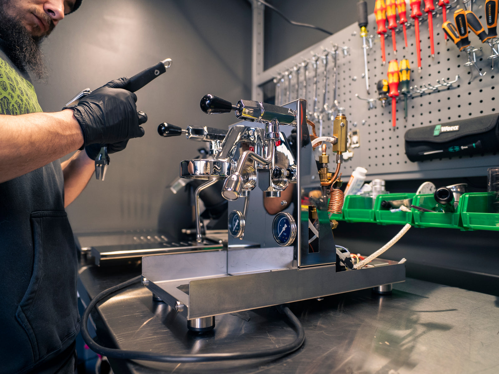 Eight Ounce Coffee Repair Man fixing an Espresso Machine